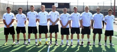 Male tennis players in a line in front of a net